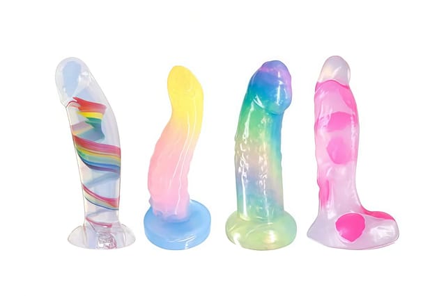 Four colorful fantasy dildos displayed on a plain white background.