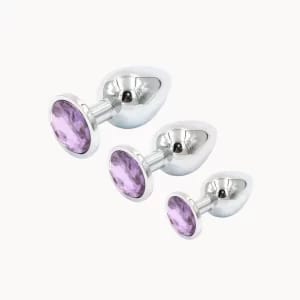 Iris Chrome anal toy on light beige background