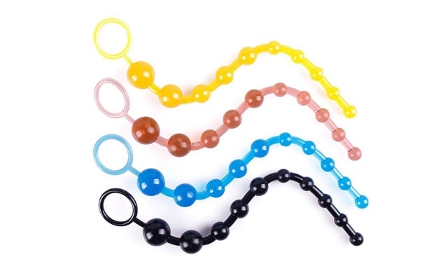 Four colors of anal beads with white background