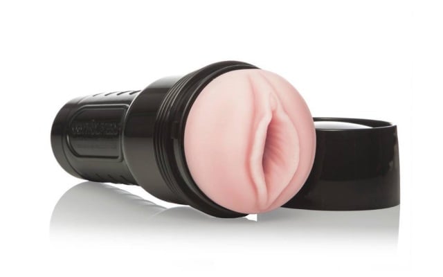 A typical fleshlight sex toy on a white background
