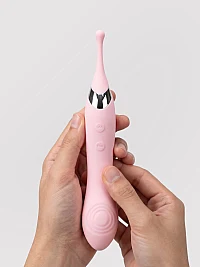 DuoRush pink dual-ended vibrator with a slender flexible tip, textured vibrating base, silver accents, and dual control buttons.