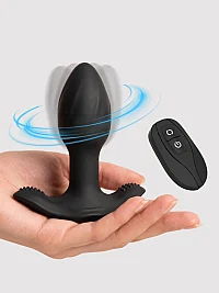 Toren black rotating prostate massager with a tapered silicone tip, wide textured base, and wireless remote control, shown with blue rotation effects.